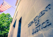 Department of Justice building with American flag.