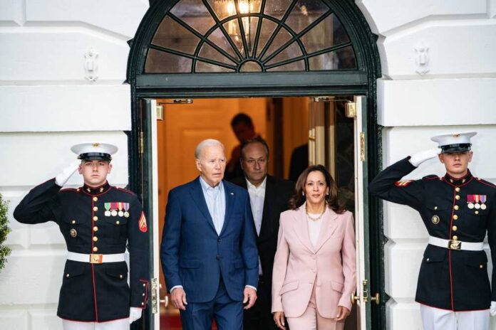 Joe Biden and Kamala Harris exit building with guards.