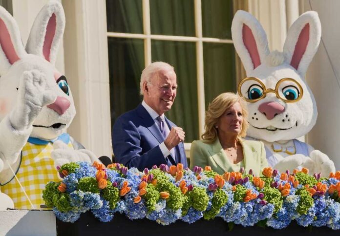 Joe and Jill Biden with Easter Bunny costumes and flower decoration.