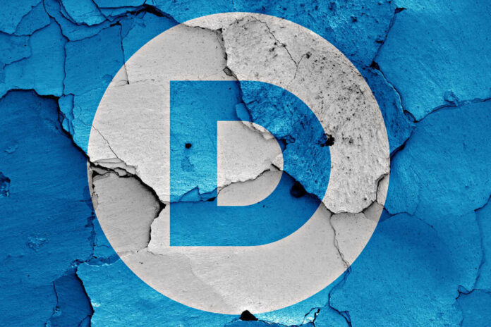 Democratic Party logo on a cracked, peeling surface.