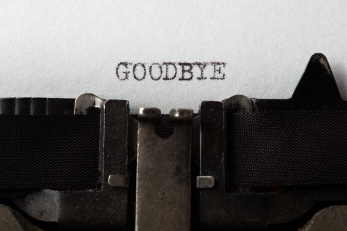 Typewriter with paper saying GOODBYE