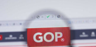 Magnifying glass focusing on GOP website logo.