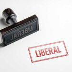 Rubber stamp with the word LIBERAL.