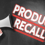 Megaphone and Product Recall text on chalkboard.