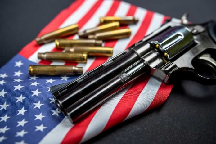 Revolver and bullets on American flag background.