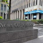 News Corporation building with electronic news ticker