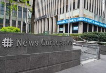 News Corporation building with electronic news ticker