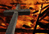 Christian cross set on fire.