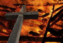 Christian cross set on fire.