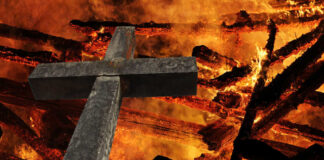 Christian cross set on fire.