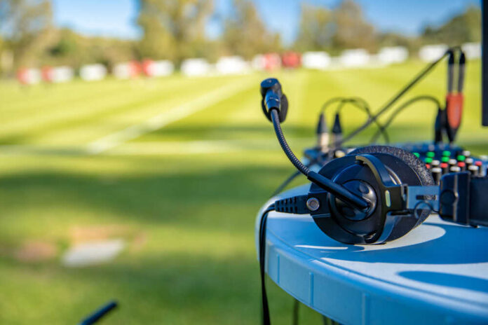 Headset and microphone on a table at field