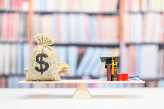 Money bag and books balanced on a seesaw.