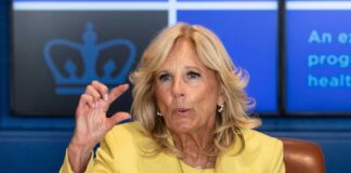 Jill Biden yellow speaking and gesturing with hand