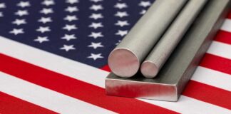 Steel stock on flag of United States of America. Steel manufacturing, production and trade concept.