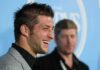 Tim Tebow smiling at an event.