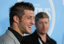 Tim Tebow smiling at an event.