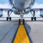 Low angle view of airplane on runway.