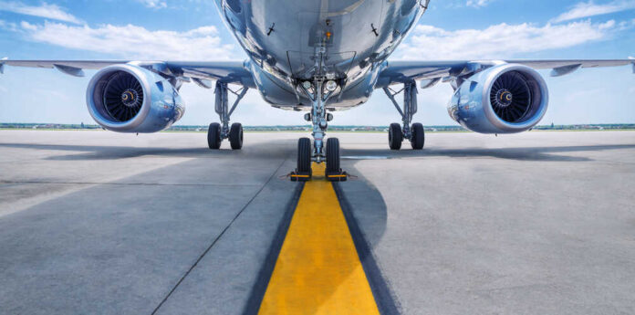 Low angle view of airplane on runway.