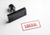 Rubber stamp with the word LIBERAL.