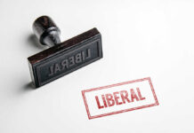 Rubber stamp with the word LIBERAL.