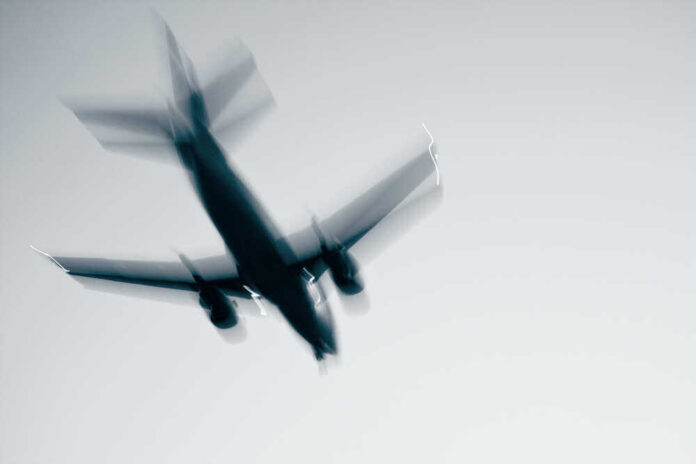 Airplane in flight with motion blur.