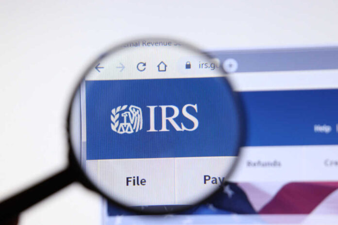 shutterstock_1586005561.jpg featured image Magnifying glass focusing on IRS website logo.
