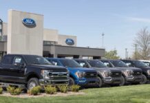 Ford dealership with trucks lined up outside