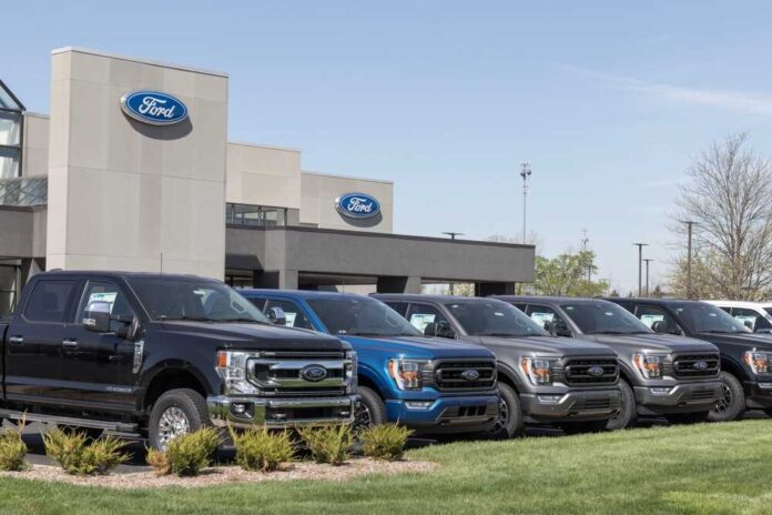 shutterstock_2289162811.jpg featured image Ford dealership with trucks lined up outside
