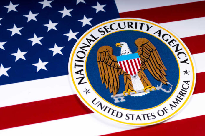 shutterstock_1054858052.jpg featured image National Security Agency logo on American flag background.
