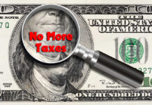 Magnifying glass over hundred dollar bill no taxes