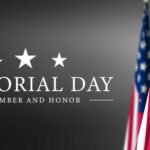 Memorial Day banner with American flags.
