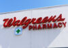 Signs for Walgreens and Pharmacy on building facade