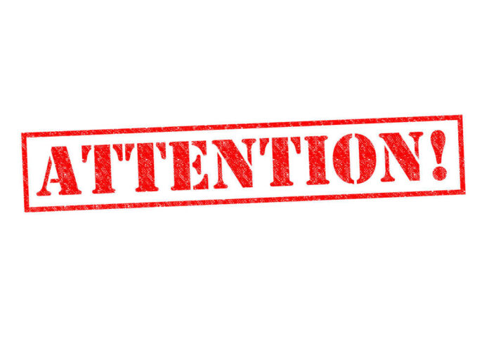 shutterstock_214851508.jpg featured image Red attention stamp on white background