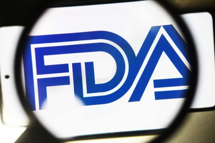 shutterstock_2274913075.jpg featured image FDA logo under magnifying glass