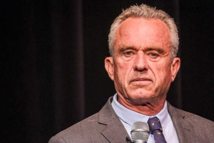 shutterstock_2341983421.jpg featured image Robert F. Kennedy JR holding microphone.