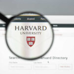 Magnifying glass focusing on Harvard University logo online