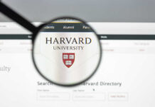 Magnifying glass focusing on Harvard University logo online
