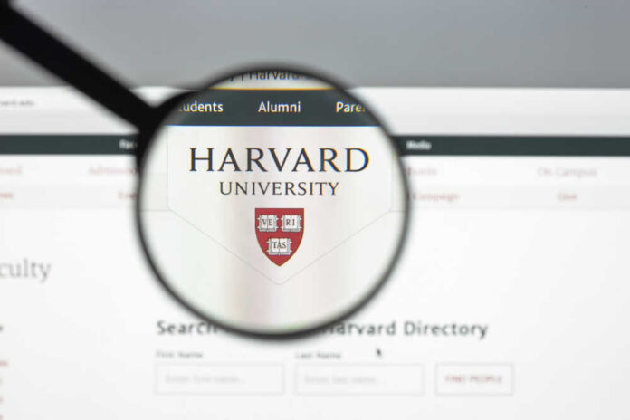shutterstock_705057400.jpg featured image Magnifying glass focusing on Harvard University logo online