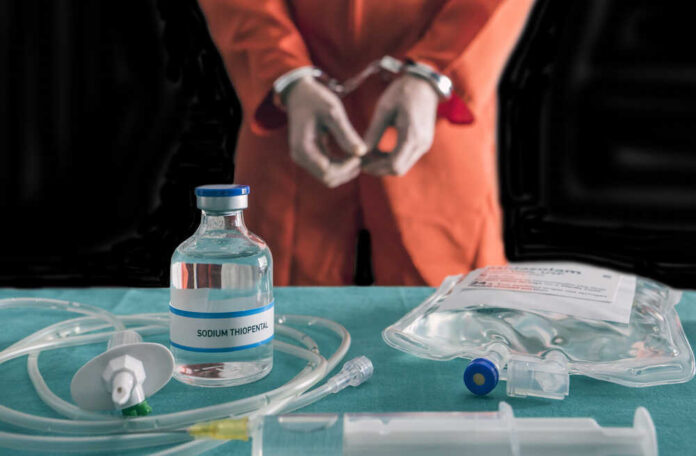 shutterstock_762356716.jpg featured image Handcuffed person in orange suit with lethal injection supplies.