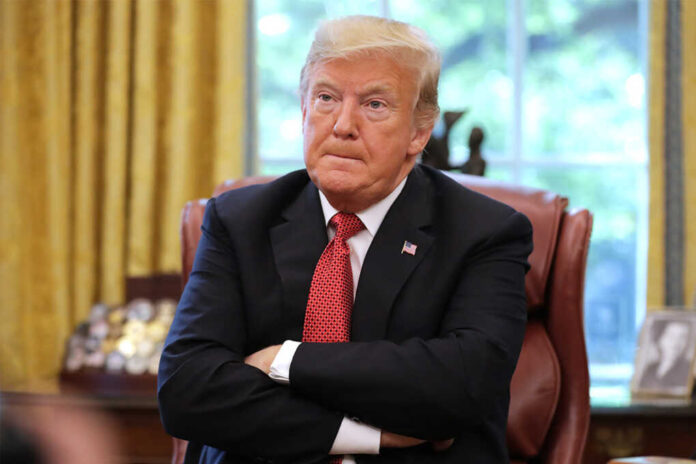 trump arms folde featured image Donald Trump