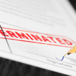 Termination document being signed with fountain pen