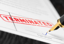 Termination document being signed with fountain pen