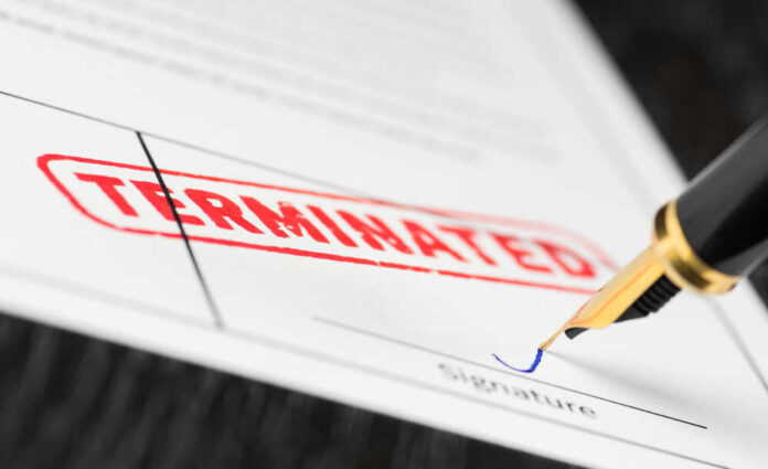 Termination document being signed with fountain pen
