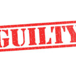 Red stamp with the word guilty inside
