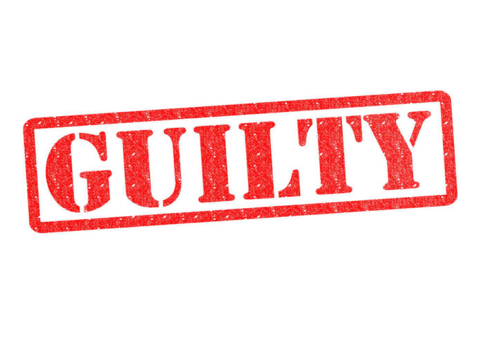 Red stamp with the word guilty inside