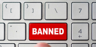 Red banned key on computer keyboard pressed