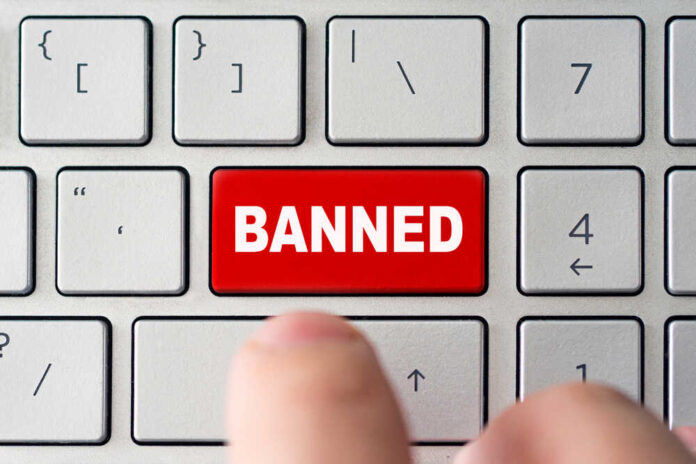 shutterstock_1790081768.jpg featured image Red banned key on computer keyboard pressed