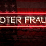 Neon sign reading Voter Fraud on American flag background.