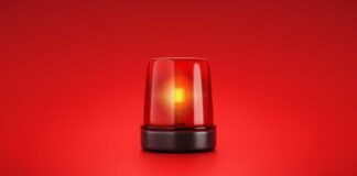 Red emergency light on red background