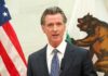Gavin Newsom speaking at podium.